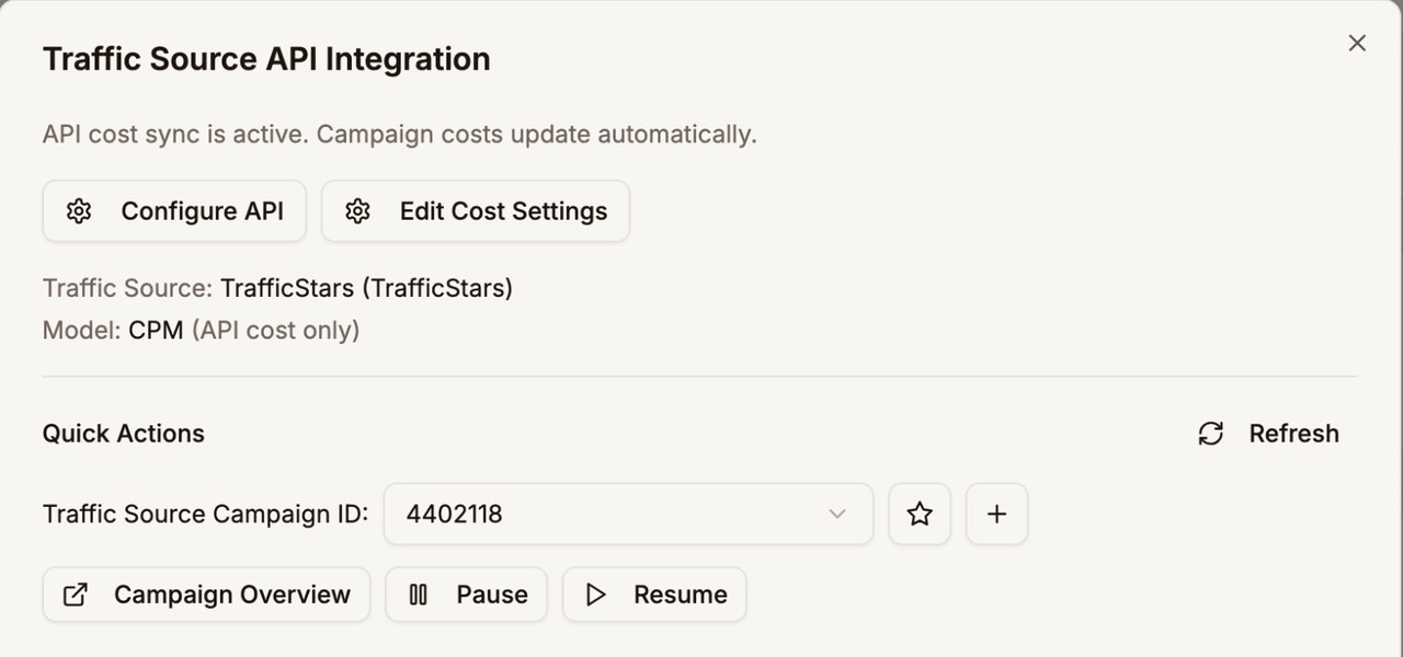 Traffic Source API Integration panel showing API cost sync is active, with Pause and Resume buttons