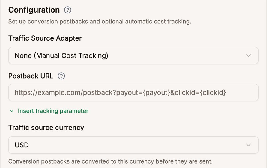 The Postback URL field with an example address, and the Traffic source currency set to USD